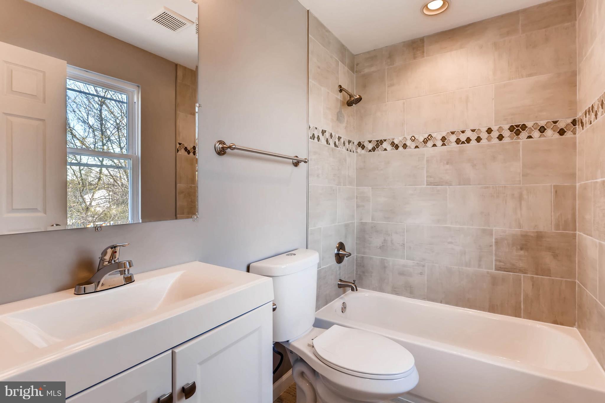 3935 Nemo Road Randallstown, MD 21133 - Photo 13 of 23 a bathroom with a sink a toilet and shower