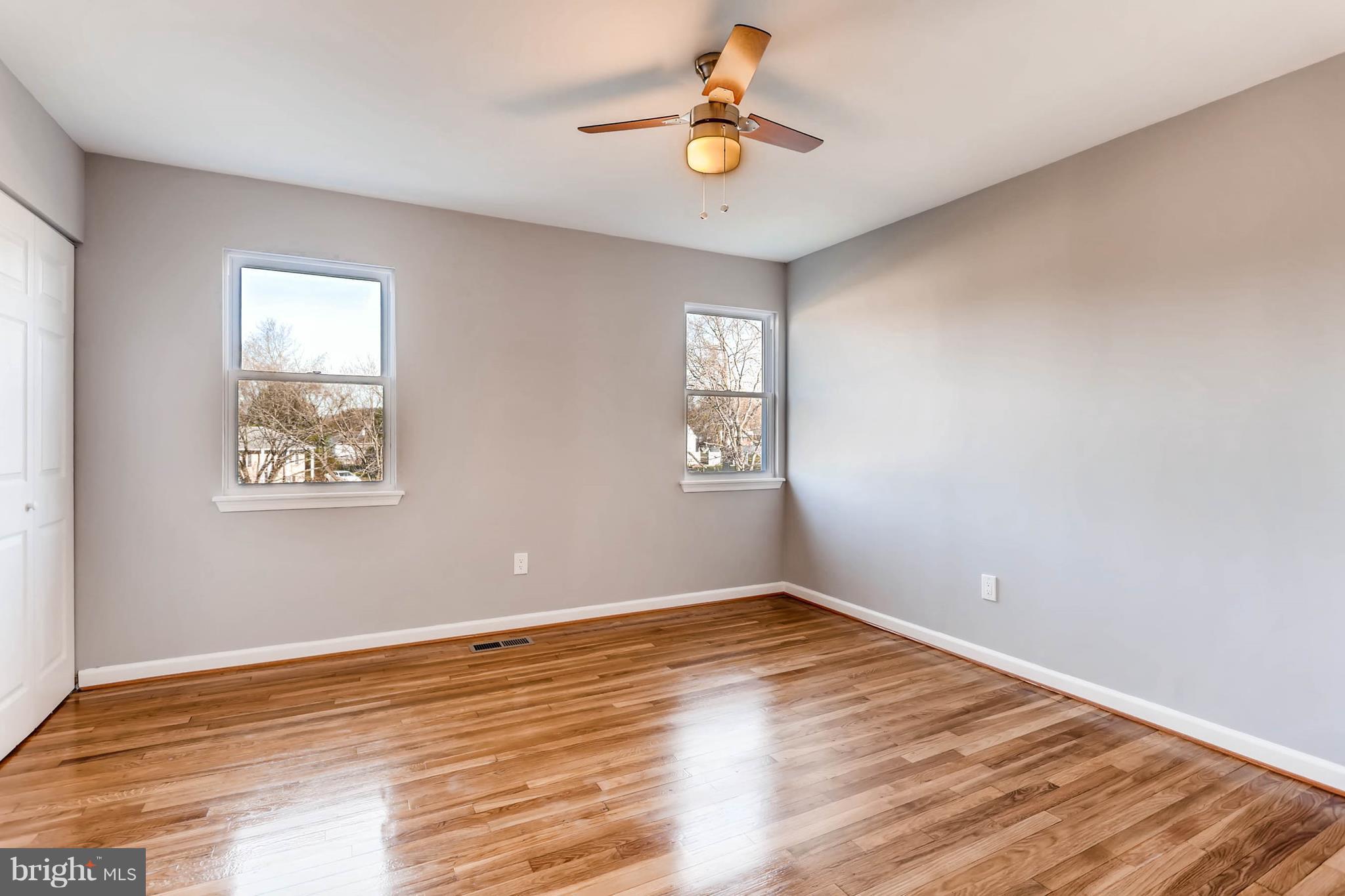 3935 Nemo Road Randallstown, MD 21133 - Photo 14 of 23 a view of empty room with wooden floor and fan