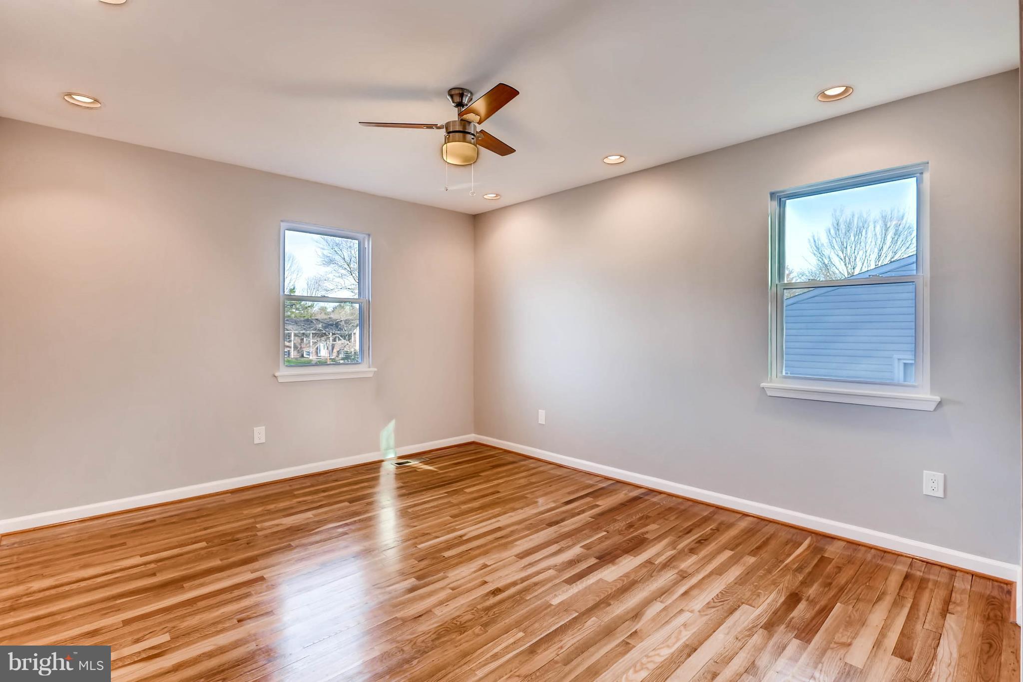 3935 Nemo Road Randallstown, MD 21133 - Photo 15 of 23 a view of empty room with wooden floor and fan