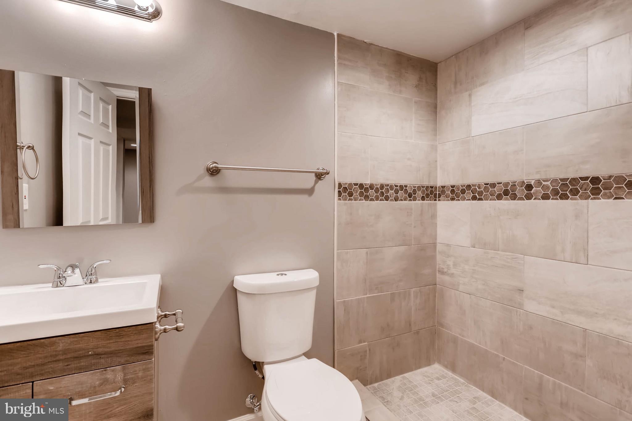 3935 Nemo Road Randallstown, MD 21133 - Photo 19 of 23 a bathroom with a shower a toilet and a sink