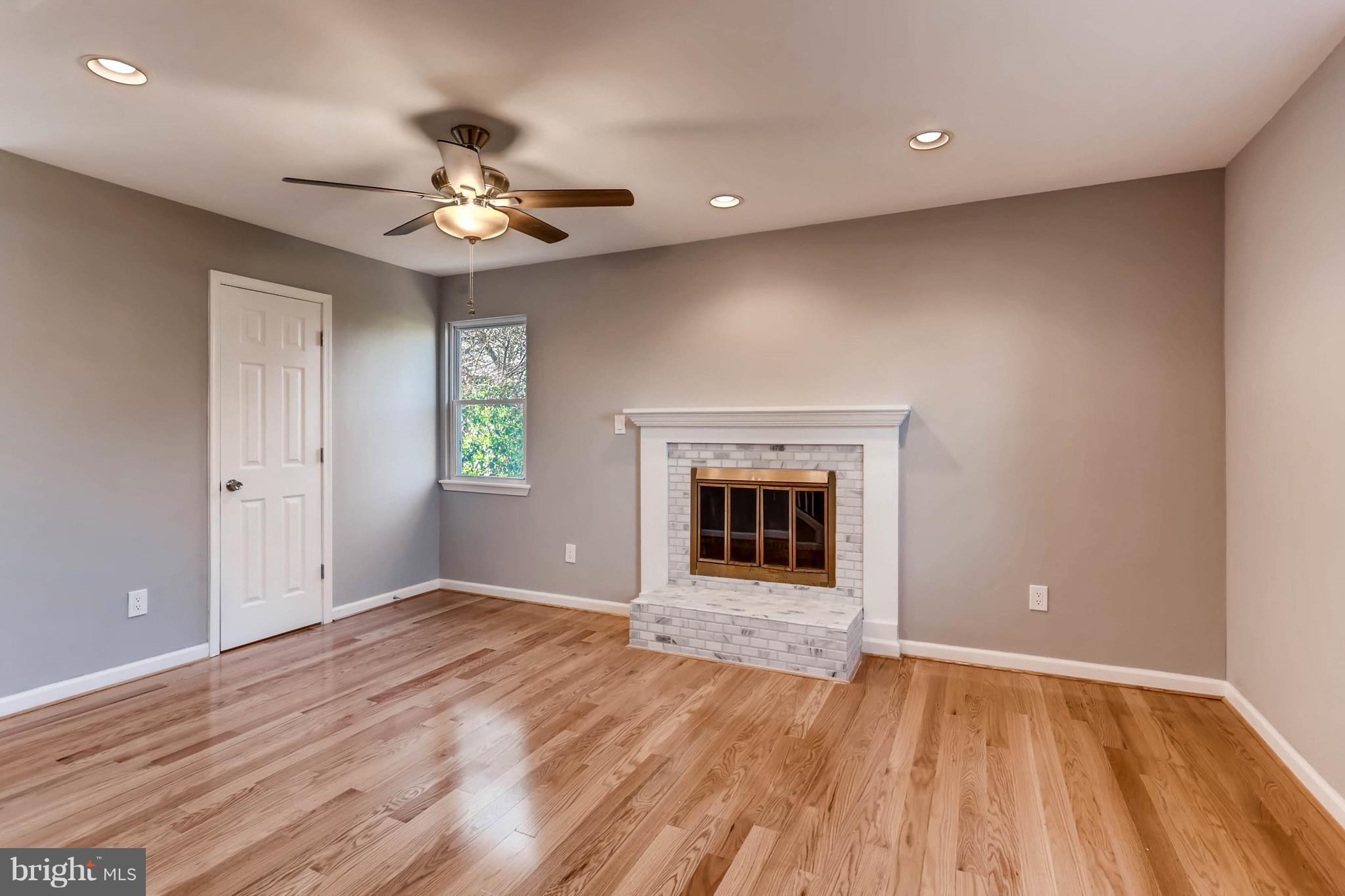 3935 Nemo Road Randallstown, MD 21133 - Photo 5 of 23 wooden floor in an empty room with a window