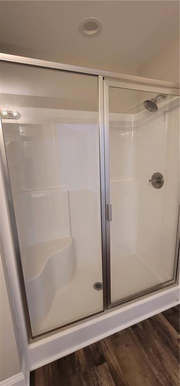 123 Ridge Crest Court Ellijay, GA 30540 - Photo 18 of 34 a bathroom with a glass shower door