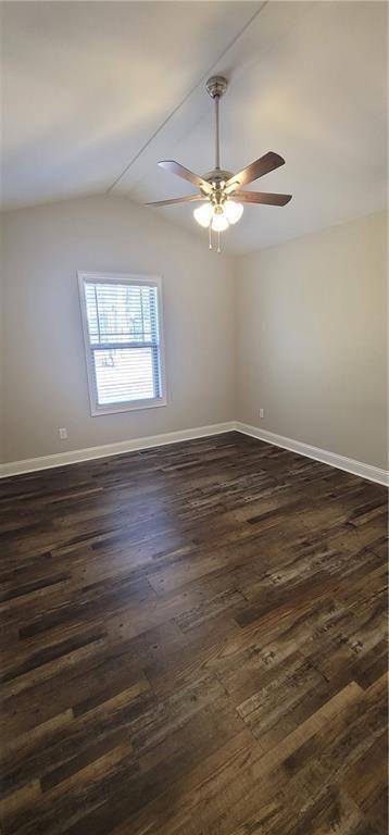 123 Ridge Crest Court Ellijay, GA 30540 - Photo 24 of 34 an empty room with wooden floor chandelier fan and window