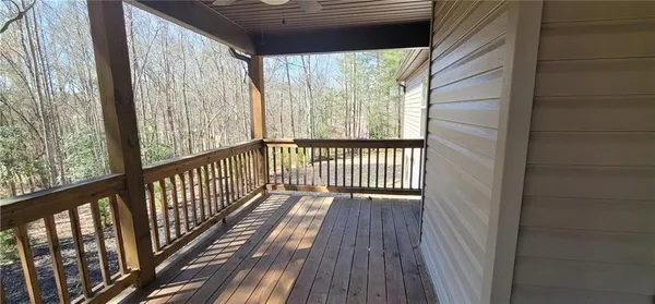 a view of balcony with wooden floor