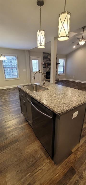 123 Ridge Crest Court Ellijay, GA 30540 - Photo 33 of 34 a kitchen with stainless steel appliances granite countertop a sink dishwasher a stove and a large mirror with wooden floor