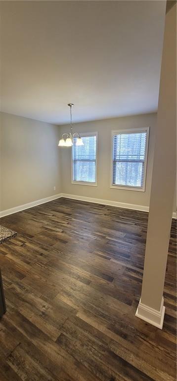 123 Ridge Crest Court Ellijay, GA 30540 - Photo 7 of 34 an empty room with wooden floor and windows