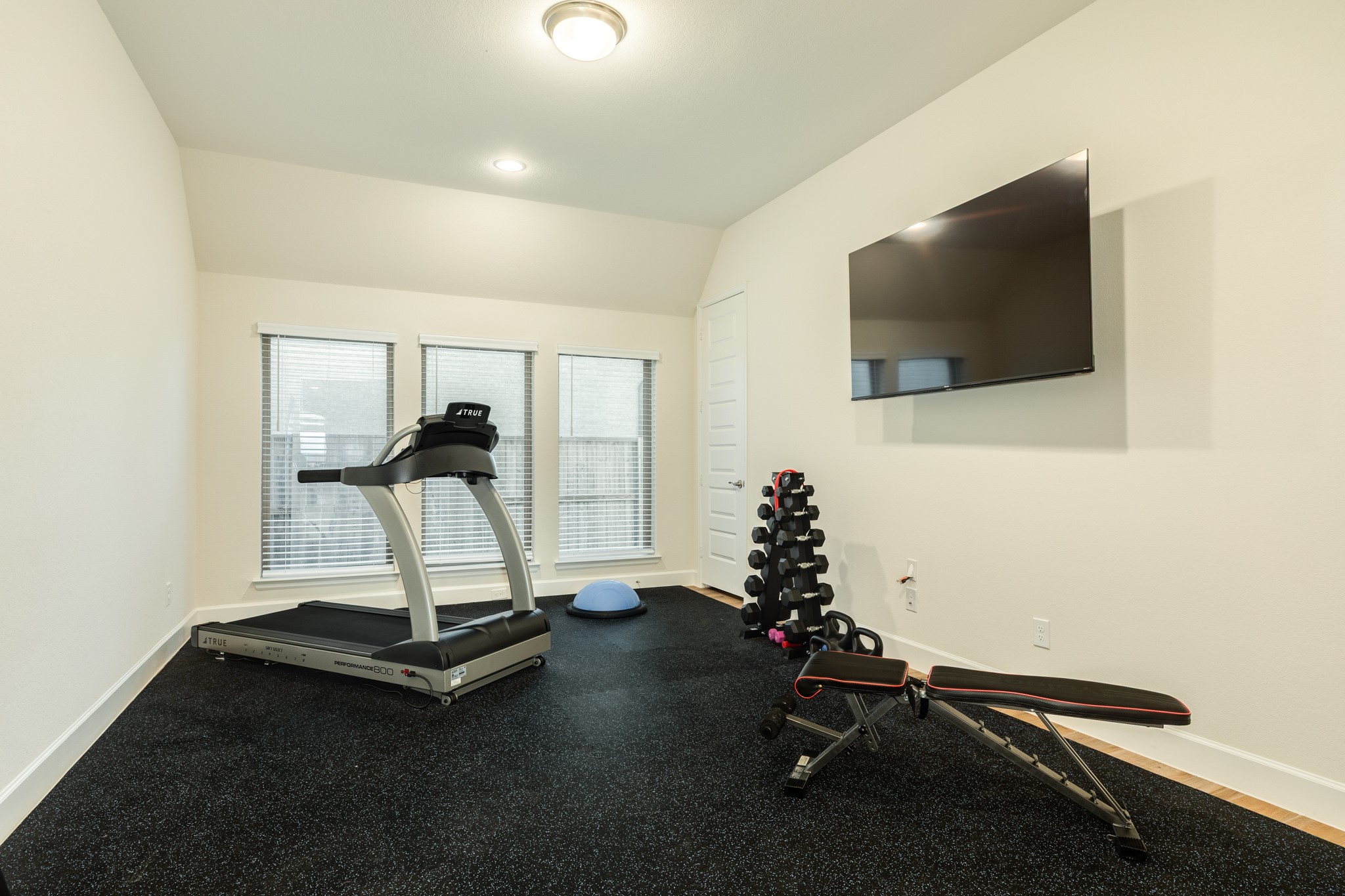 9538 Sanger Way Manvel, TX 77578 - Photo 24 of 50 Spacious game room featuring a large closet, natural light from multiple windows, and versatile potential for use as a fifth bedroom or home gym.