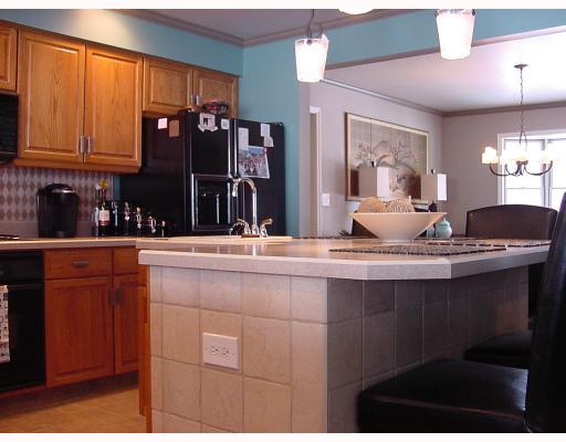 830 Middletown Road New Stanton, PA 15672 - Photo 4 of 8 Kitchen. Lovely redone kitchen island, flooring, backsplash and lighting, prep sink, stunning. Open feel with dining area in background. Must see to appreciate!
