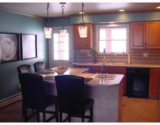 830 Middletown Road New Stanton, PA 15672 - Photo 5 of 8 Kitchen. View from dining room to rear patio. What attention to detail. Your buyers will love this kitchen made for entertaining.