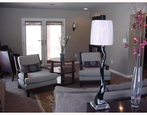 830 Middletown Road New Stanton, PA 15672 - Photo 7 of 8 Den/Family/Great Room. Spacious great room with recessed lighting, surround sound, wet bar w/refrigerator, fireplace and Double doors to covered patio and pool. It could be yours!