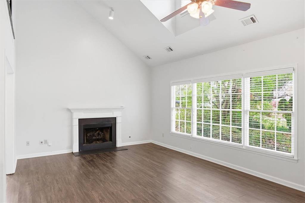 139 Stanbrough Drive Dallas, GA 30157 - Photo 13 of 52 wooden floor fireplace and windows in an empty room