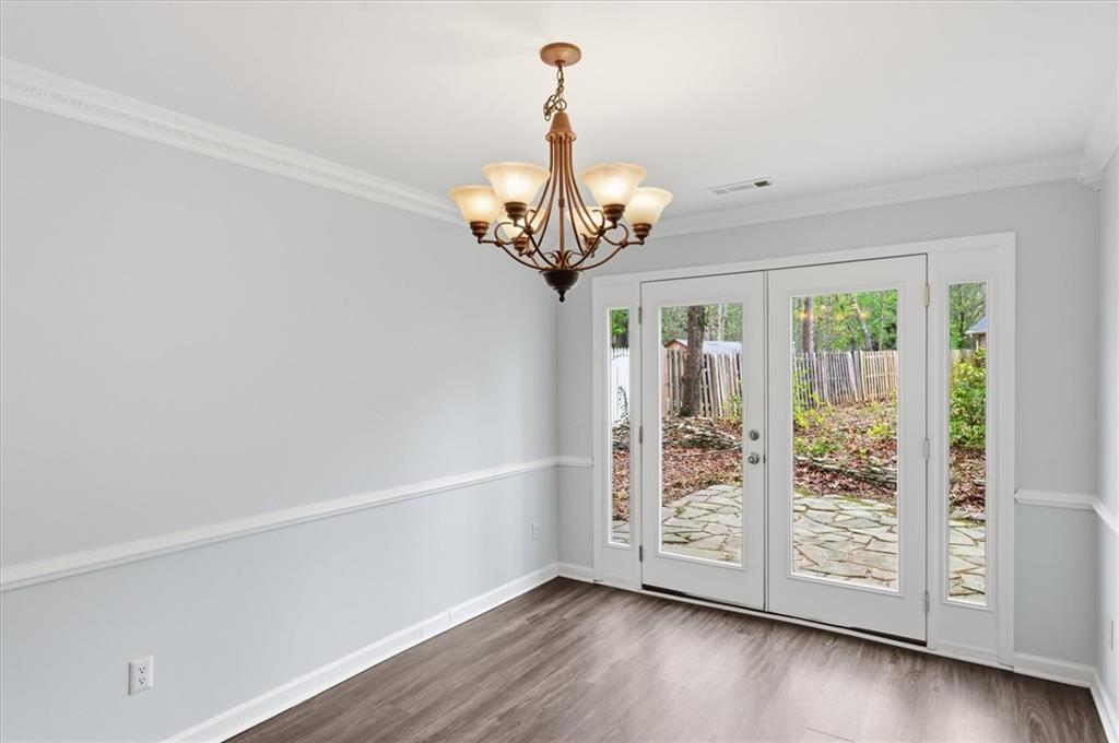 139 Stanbrough Drive Dallas, GA 30157 - Photo 14 of 52 a view of a chandelier in wooden floor