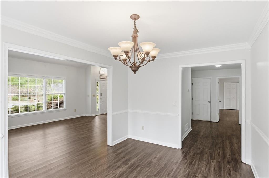 139 Stanbrough Drive Dallas, GA 30157 - Photo 15 of 52 a view of a room with wooden floor chandelier and windows
