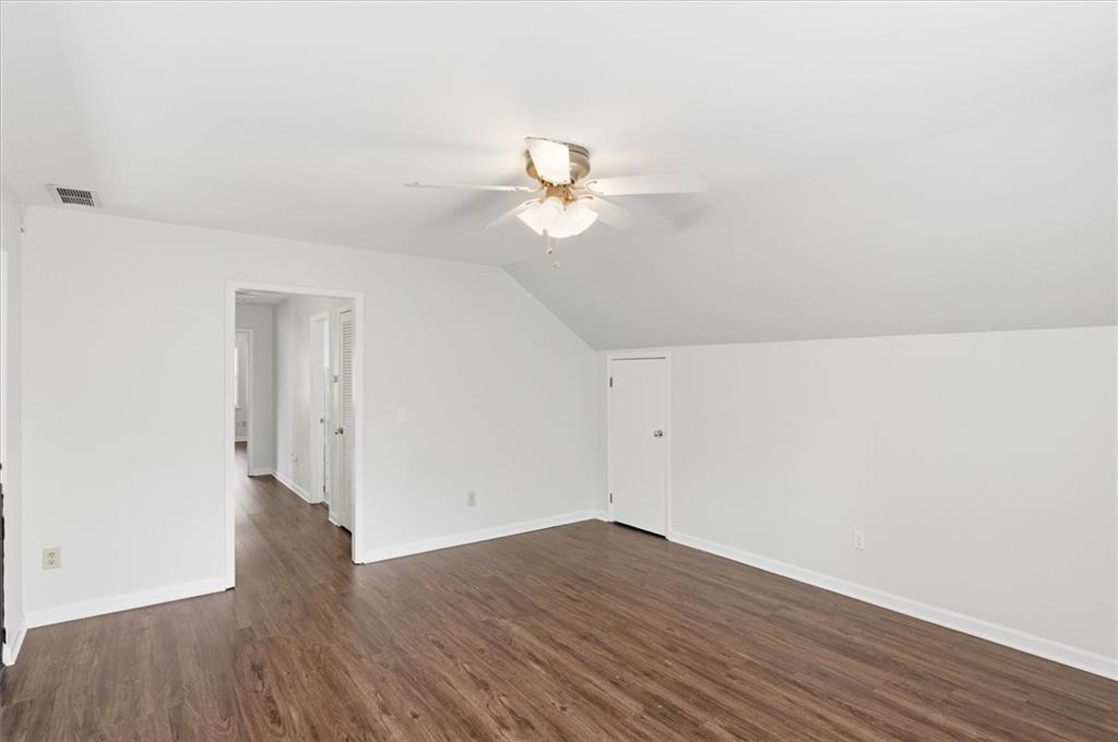 139 Stanbrough Drive Dallas, GA 30157 - Photo 28 of 52 a view of a room with wooden floor and a ceiling fan