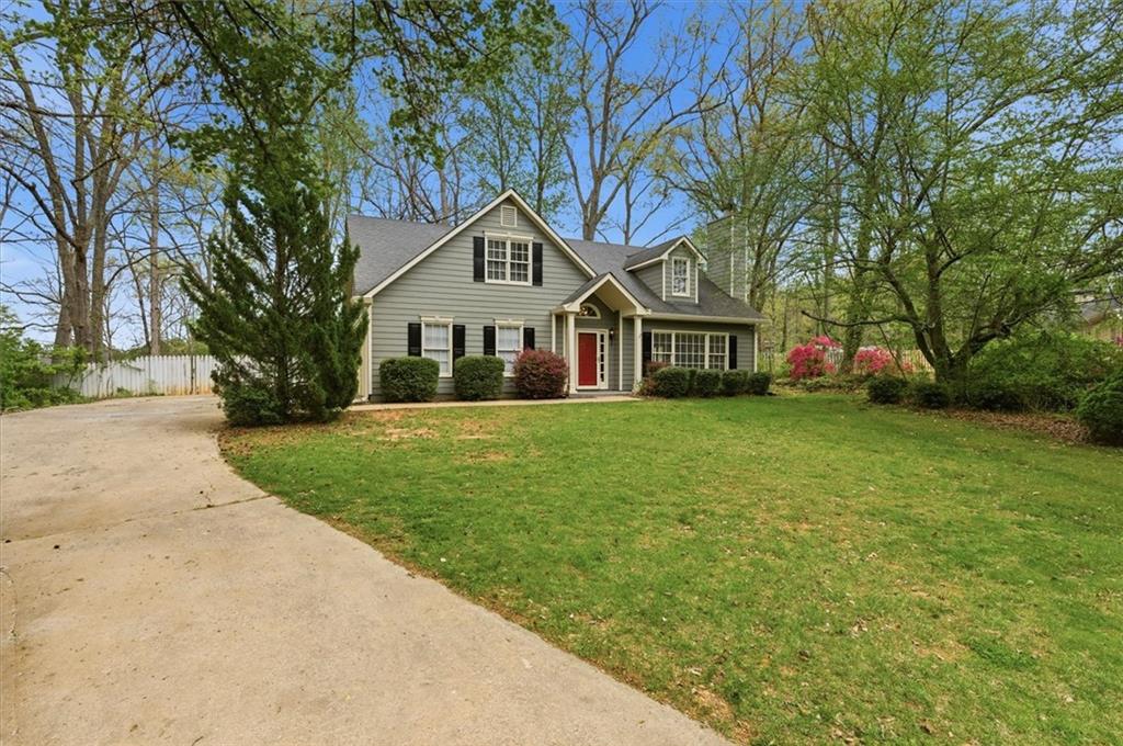 139 Stanbrough Drive Dallas, GA 30157 - Photo 3 of 52 a front view of a house with a yard and trees