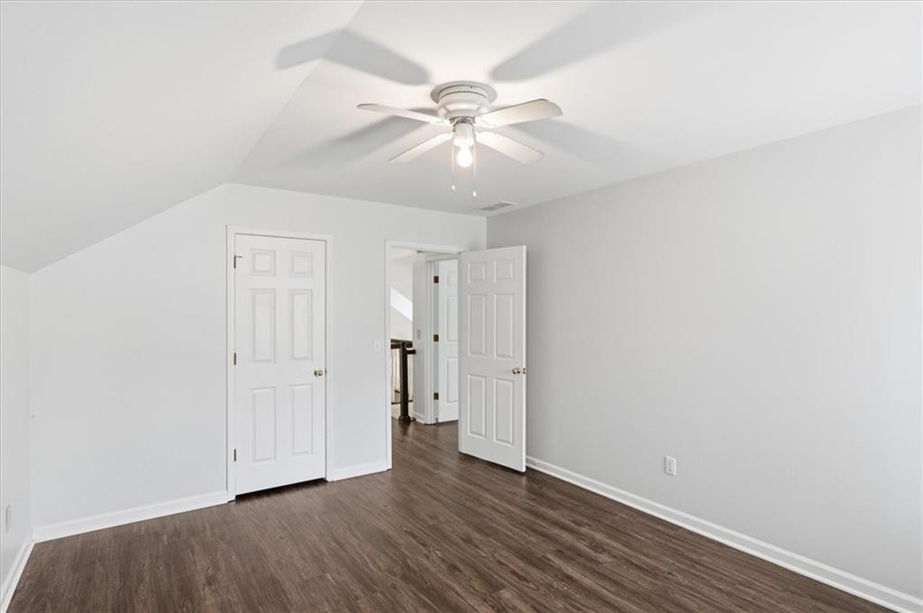139 Stanbrough Drive Dallas, GA 30157 - Photo 31 of 52 an empty room with wooden floor and ceiling fan