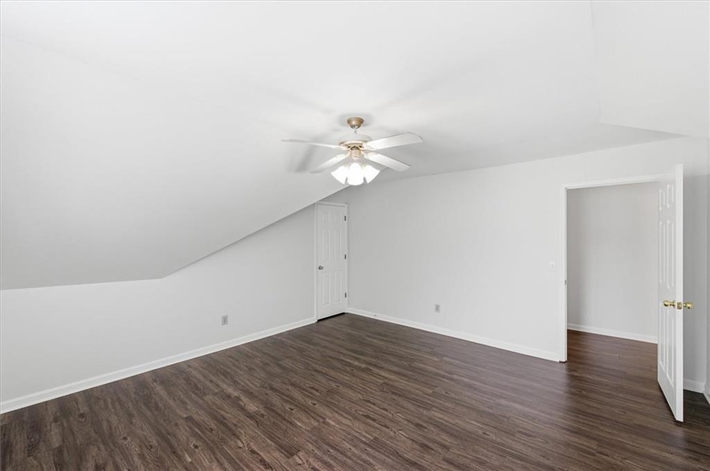 139 Stanbrough Drive Dallas, GA 30157 - Photo 33 of 52 a view of a room with wooden floor and a ceiling fan