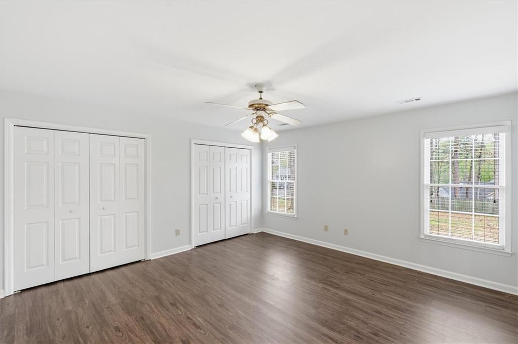 139 Stanbrough Drive Dallas, GA 30157 - Photo 34 of 52 a view of an empty room with wooden floor and a window