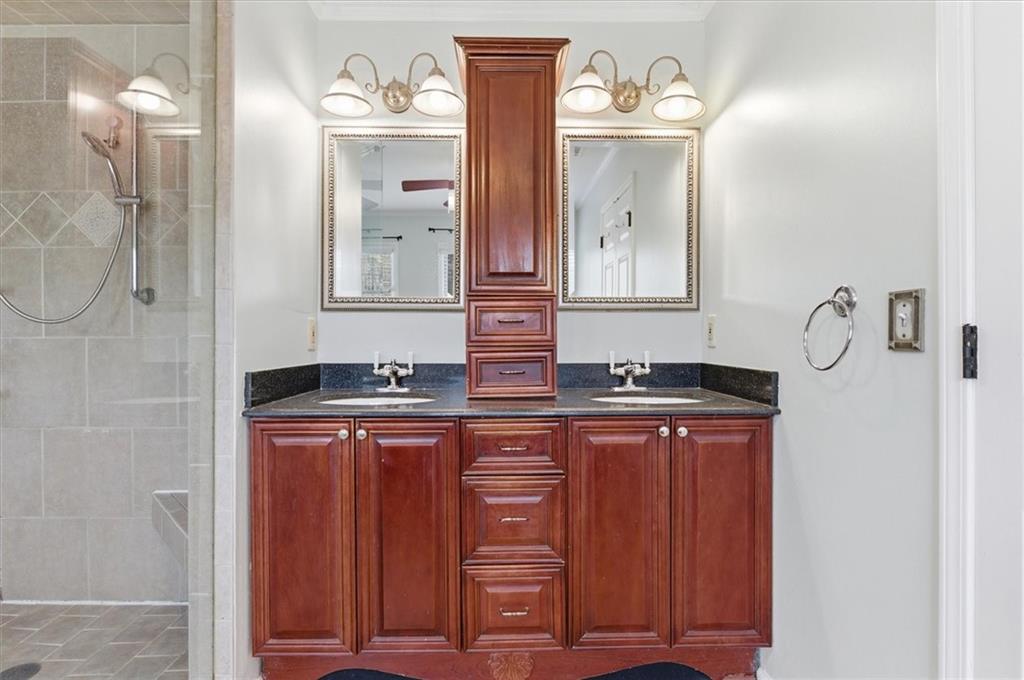 139 Stanbrough Drive Dallas, GA 30157 - Photo 38 of 52 a bathroom with a sink and a mirror