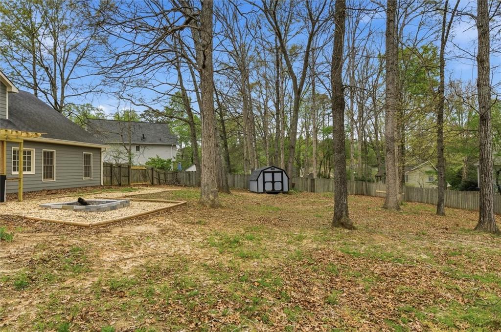 139 Stanbrough Drive Dallas, GA 30157 - Photo 47 of 52 a view of a house with a backyard and tree