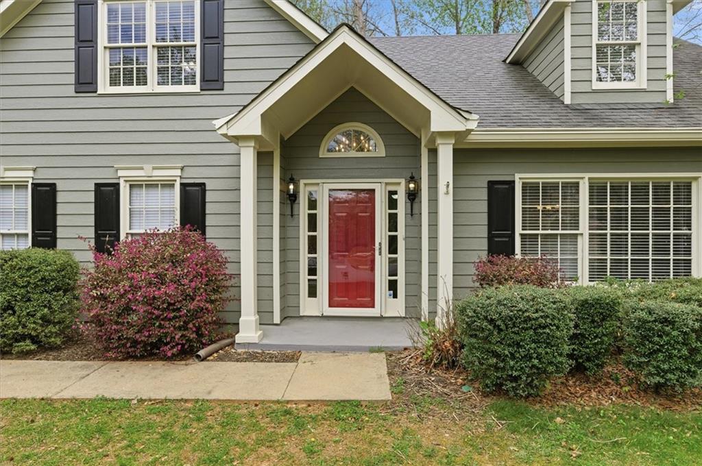 139 Stanbrough Drive Dallas, GA 30157 - Photo 5 of 52 a view of a brick house with large windows