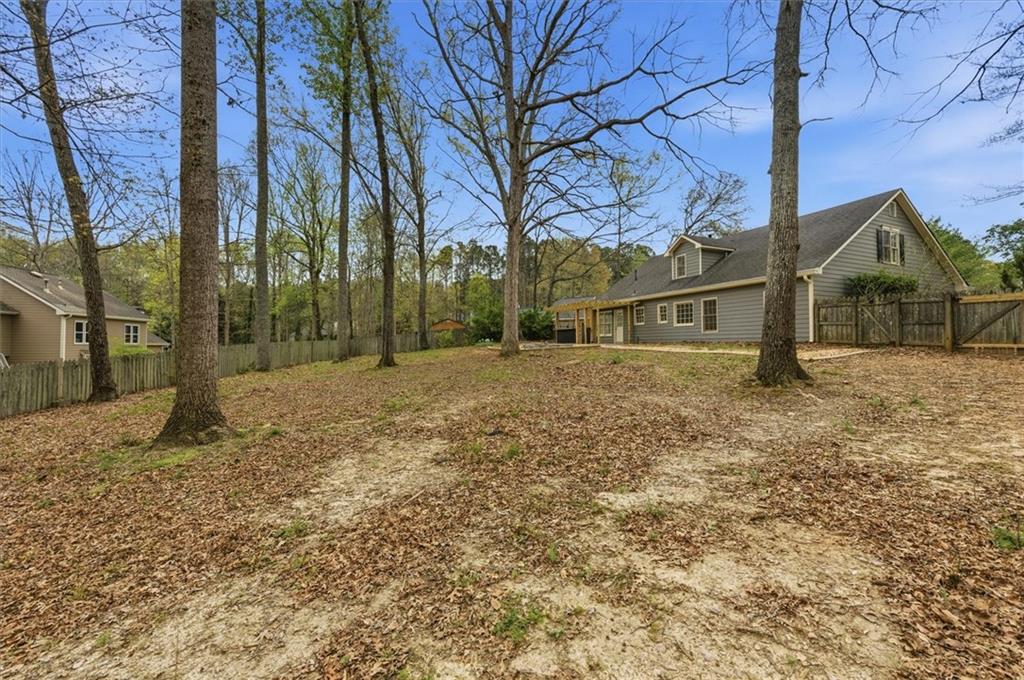 139 Stanbrough Drive Dallas, GA 30157 - Photo 51 of 52 a backyard of a house with large trees