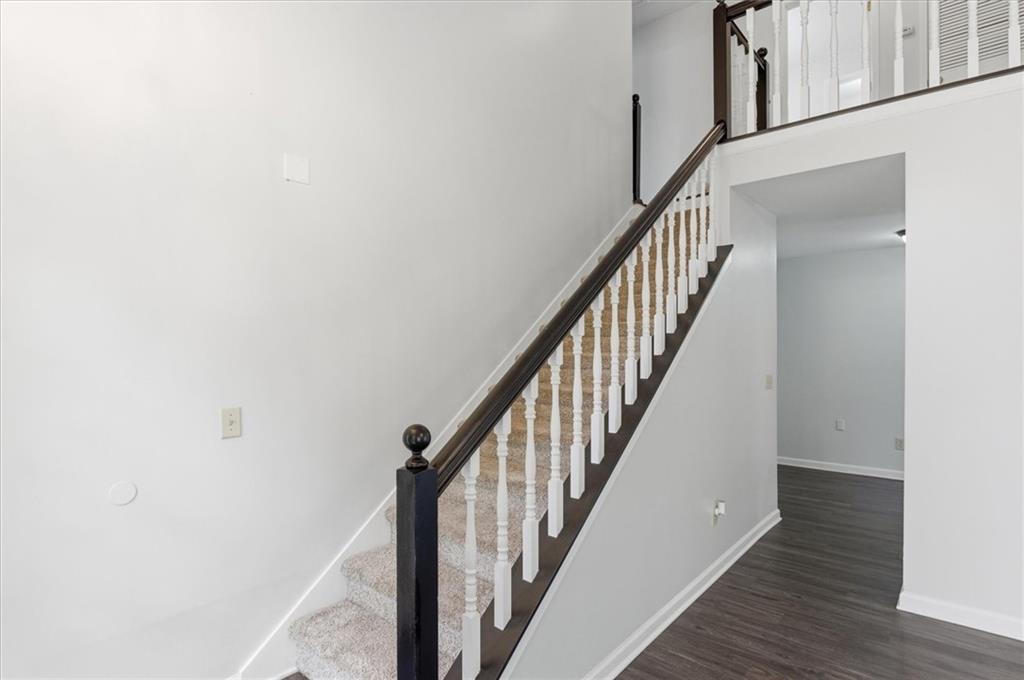139 Stanbrough Drive Dallas, GA 30157 - Photo 7 of 52 a view of staircase with wooden floor and white walls