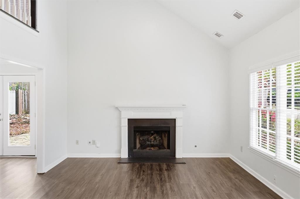 139 Stanbrough Drive Dallas, GA 30157 - Photo 9 of 52 a view of an empty room with wooden floor and a window