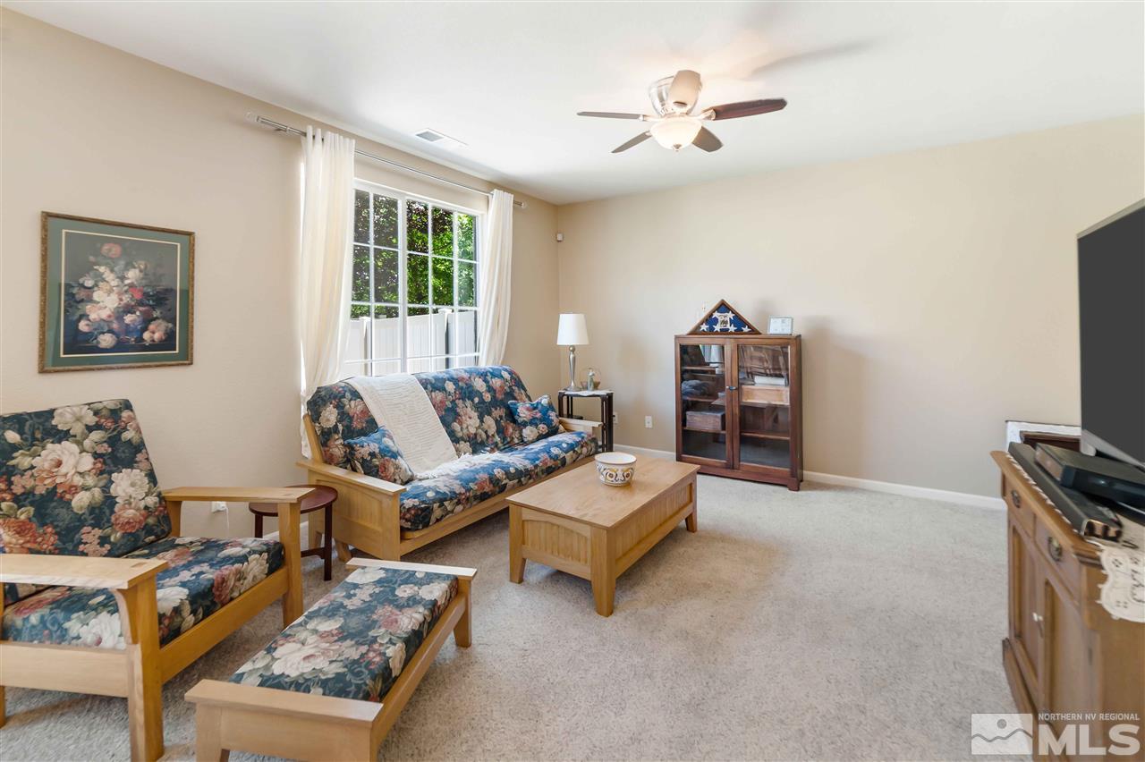 1875 Stetson Drive Reno, NV 89521 - Photo 12 of 27 a living room with furniture and a flat screen tv