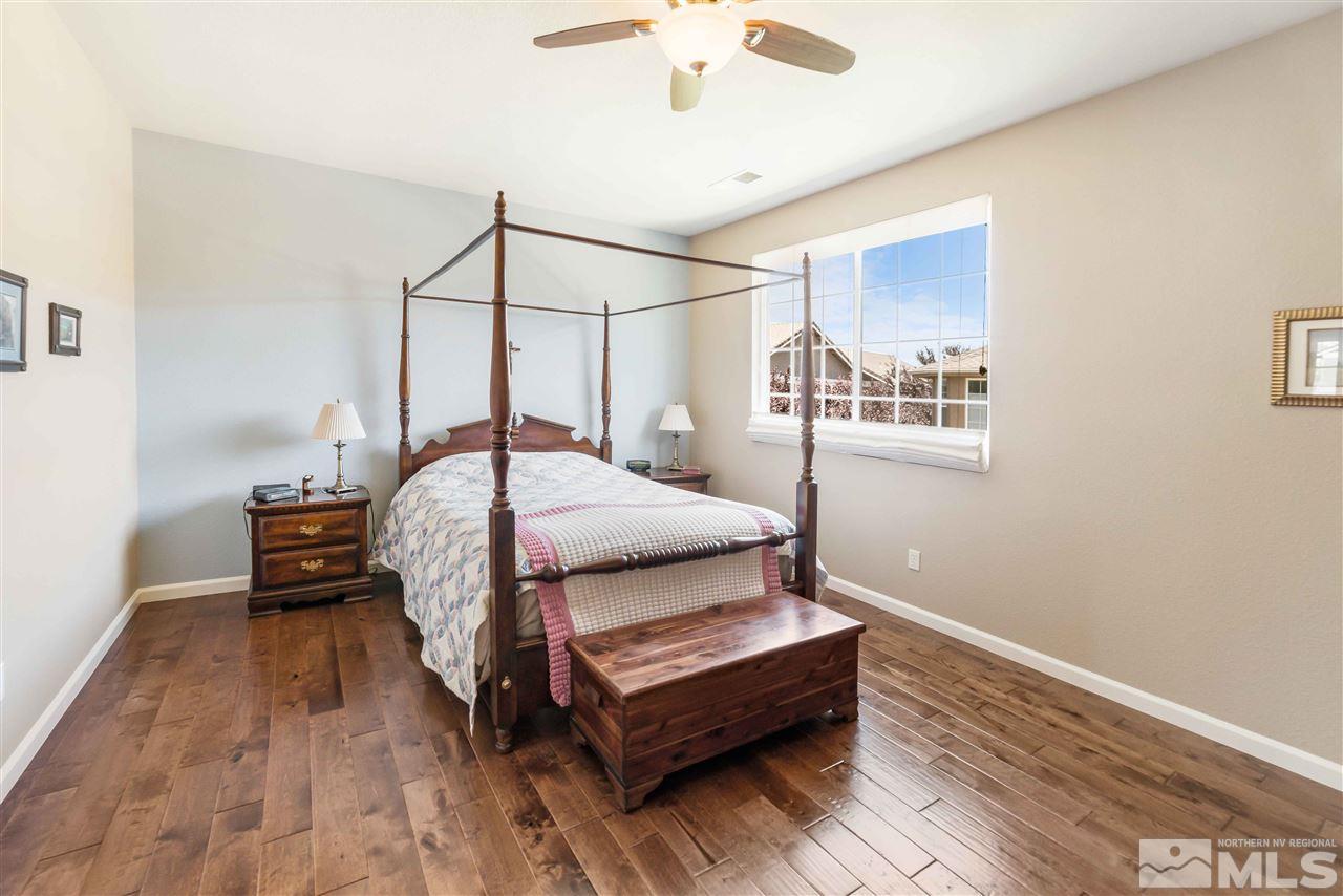 1875 Stetson Drive Reno, NV 89521 - Photo 16 of 27 a bedroom with a bed table and a window