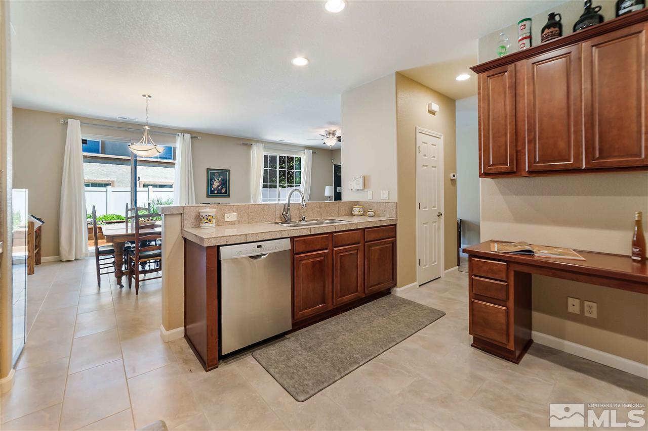 1875 Stetson Drive Reno, NV 89521 - Photo 2 of 27 a kitchen with a sink stove and cabinets