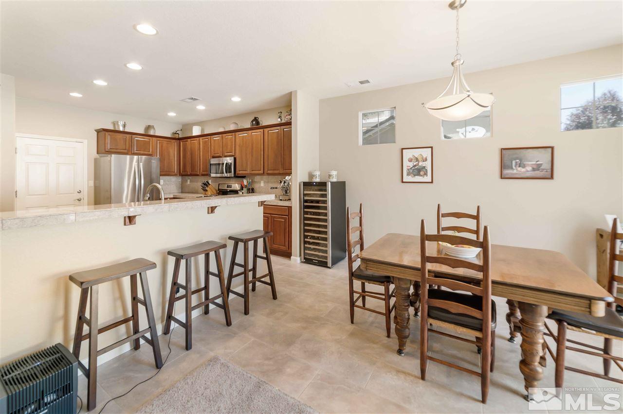 1875 Stetson Drive Reno, NV 89521 - Photo 4 of 27 a large kitchen with a table and chairs