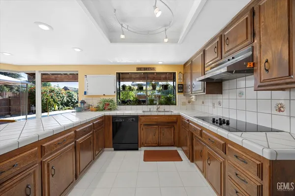 a spacious bathroom with a double vanity sink and a mirror