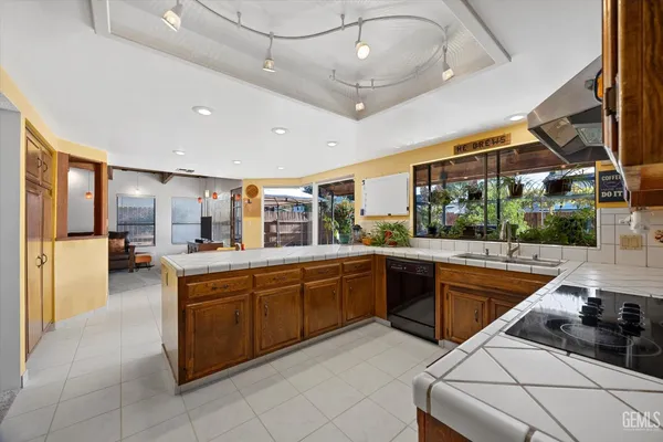 a view of a patio with a table and chairs under an umbrella
