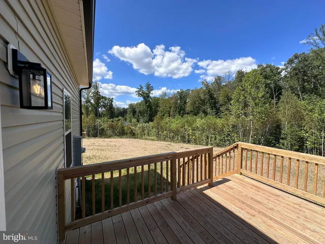 a view of a wooden deck with sunset view