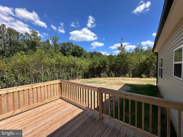 a view of a balcony with wooden floor