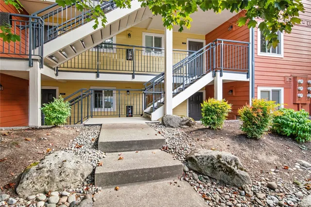 a view of a white building among the front of house
