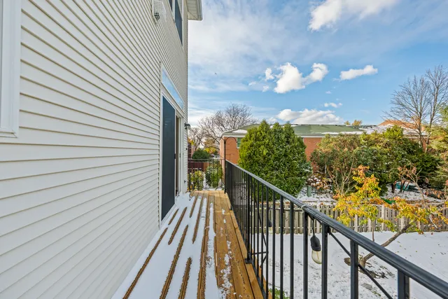 a view of a balcony with wooden floor