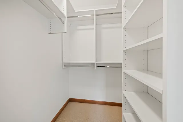 a view of an empty walk in closet