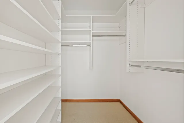 a view of an empty walk in closet
