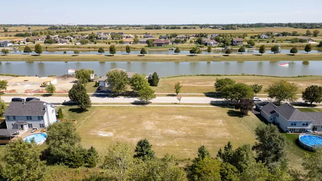 an aerial view of a house with a lake view