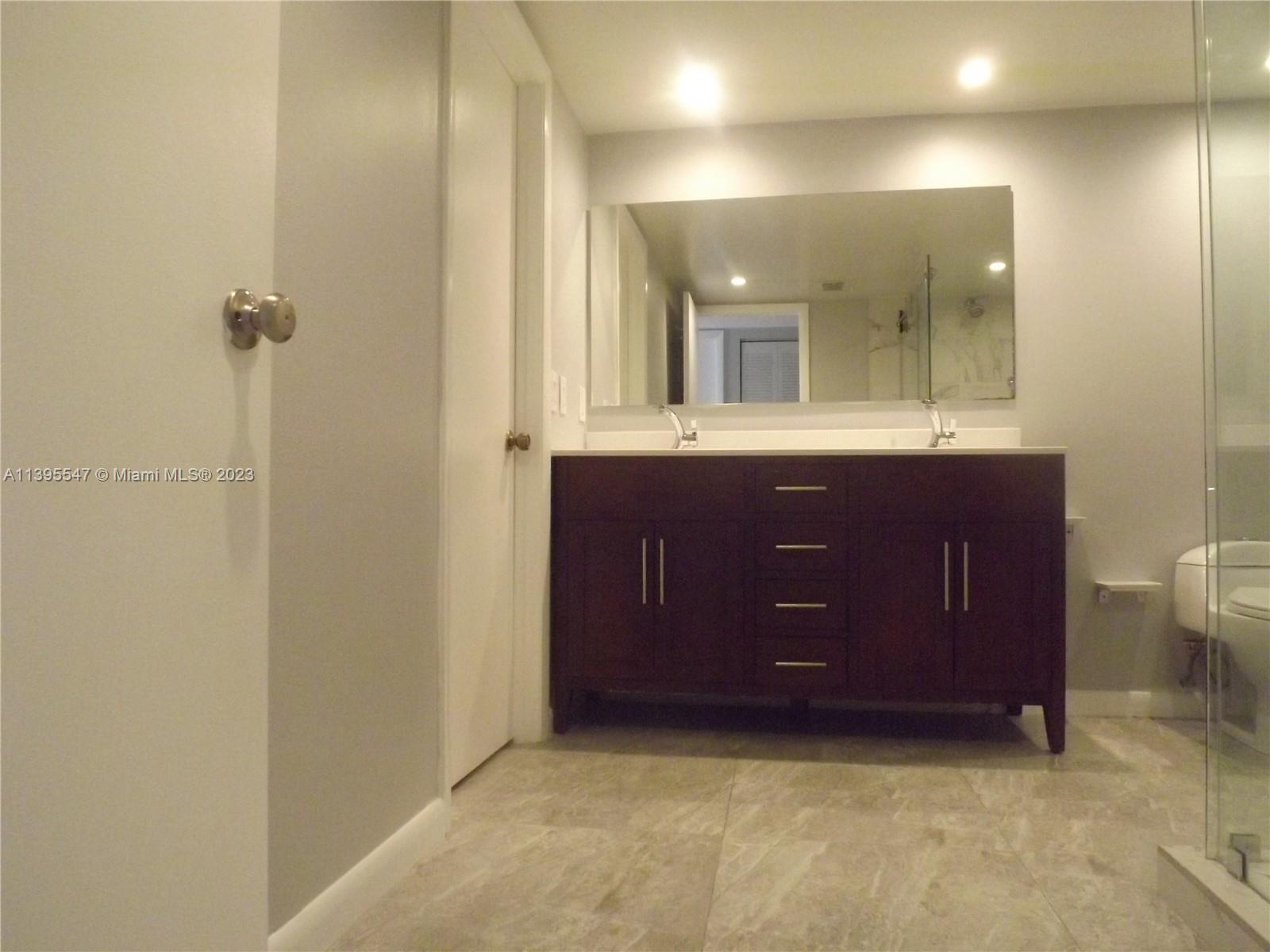 Kendall Miami, FL 33173 - Photo 13 of 34 a bathroom with a sink and mirror