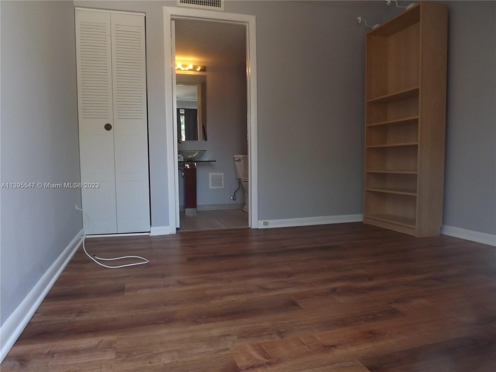 Kendall Miami, FL 33173 - Photo 17 of 34 a view of a room with wooden floor and closet