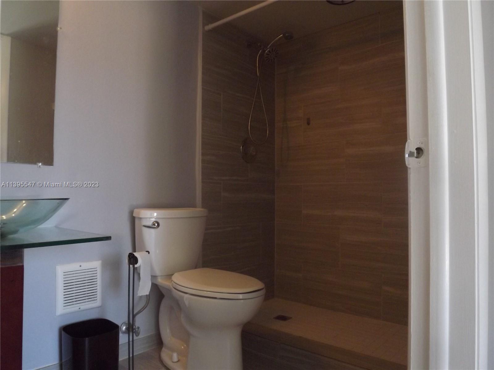 Kendall Miami, FL 33173 - Photo 19 of 34 a bathroom with a toilet and shower