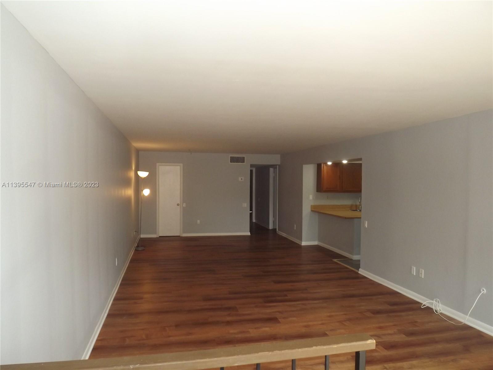 Kendall Miami, FL 33173 - Photo 5 of 34 a view of a hallway with wooden floor