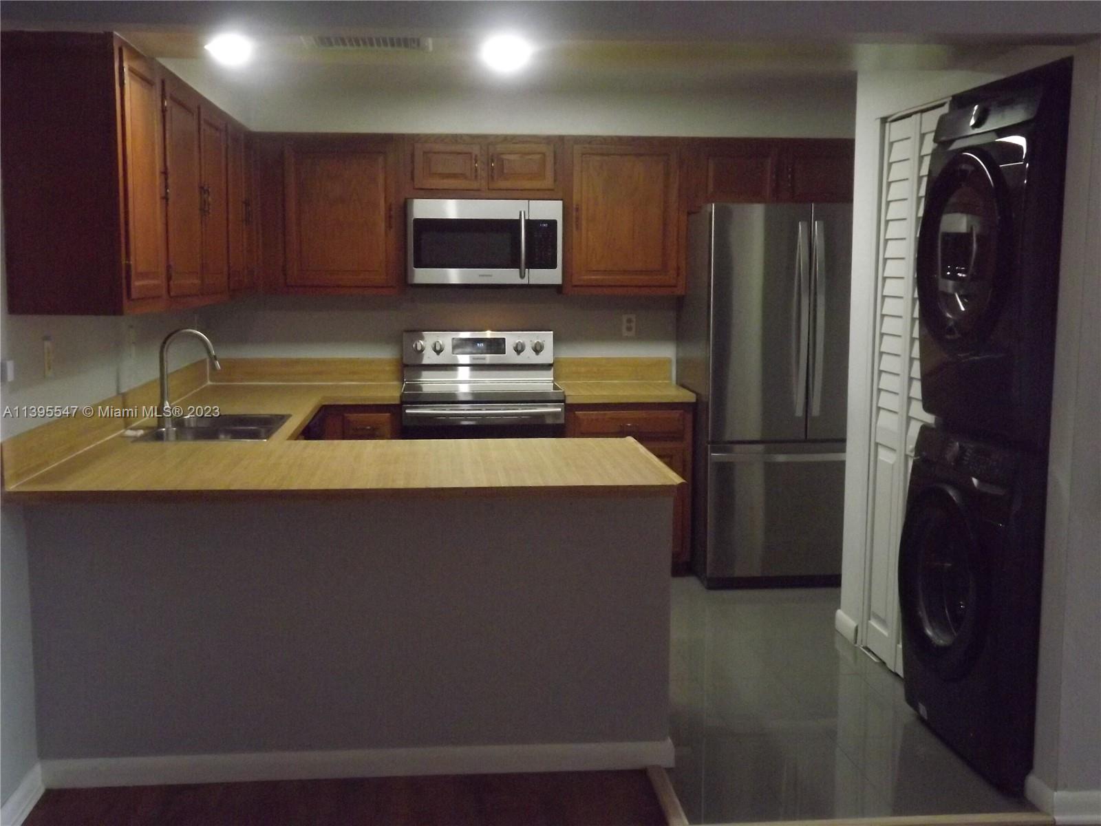 Kendall Miami, FL 33173 - Photo 7 of 34 a kitchen with a refrigerator and a sink