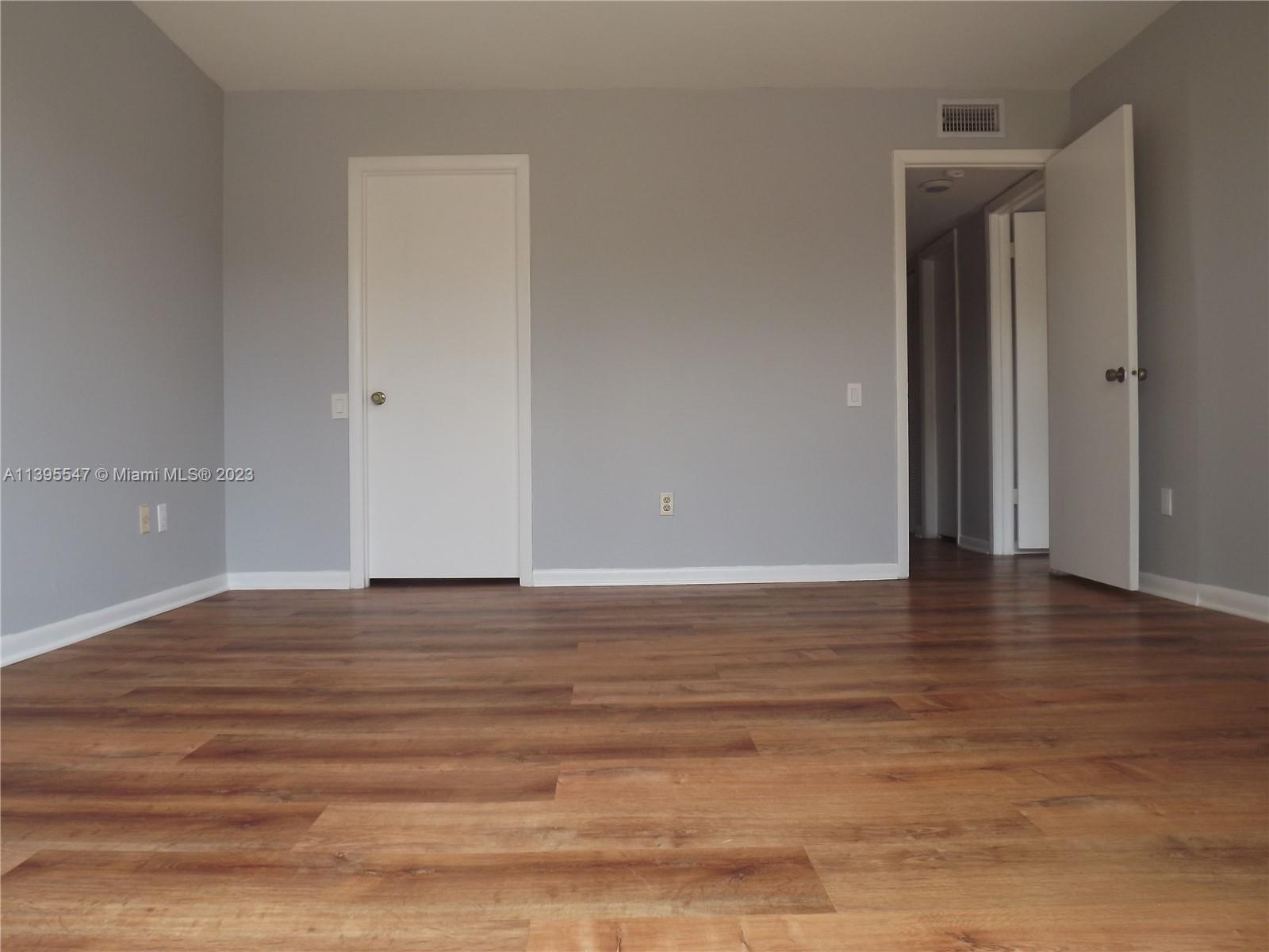 Kendall Miami, FL 33173 - Photo 10 of 34 a view of room with window and wooden floor