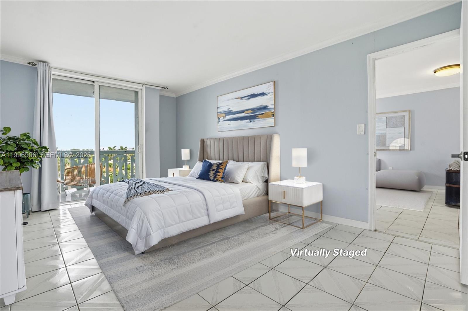 8233 Harding Avenue, Unit 504 Miami Beach, FL 33141 - Photo 12 of 24 a spacious bedroom with a bed and a large window