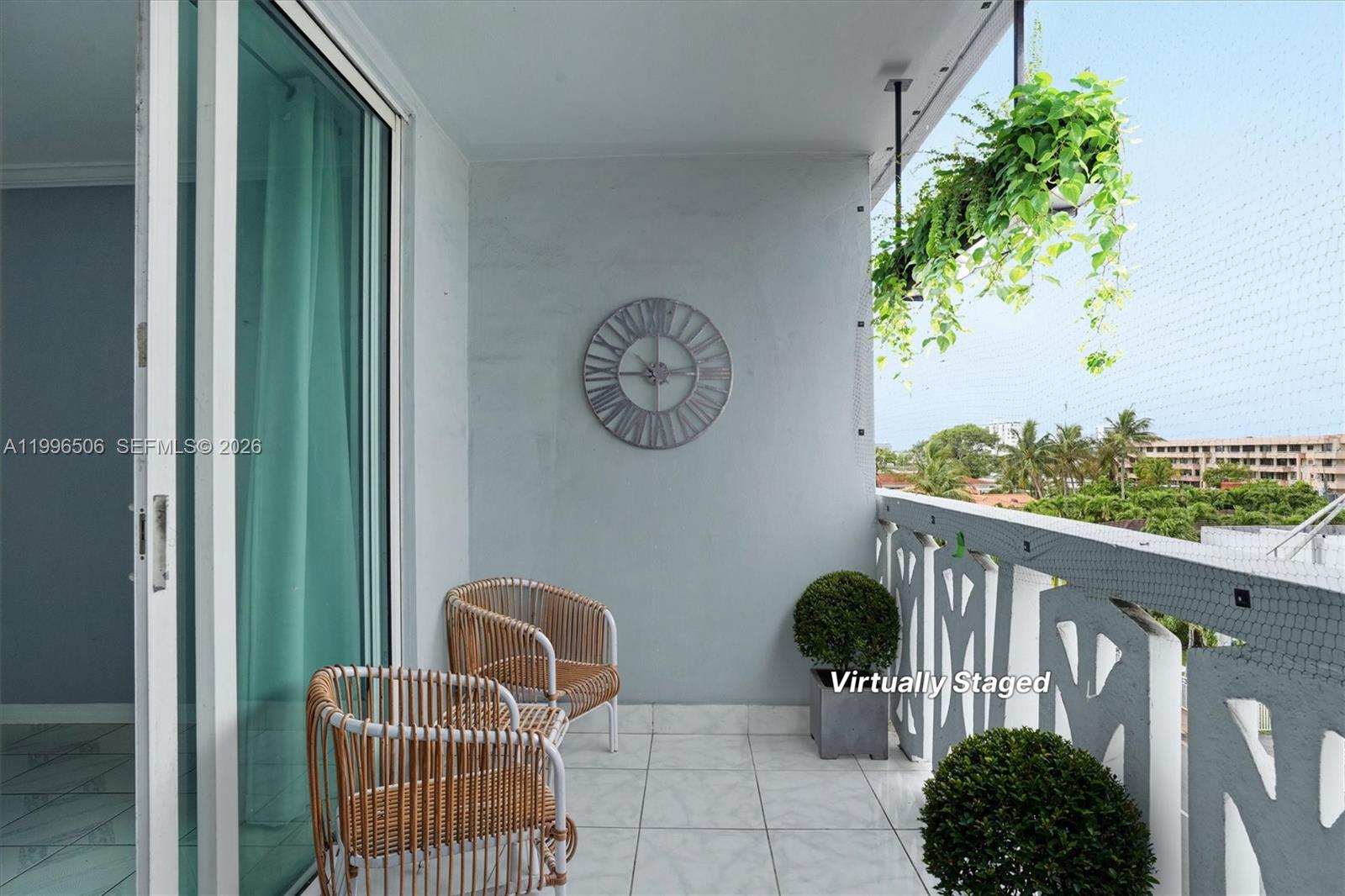 8233 Harding Avenue, Unit 504 Miami Beach, FL 33141 - Photo 5 of 24 a view of a porch with furniture
