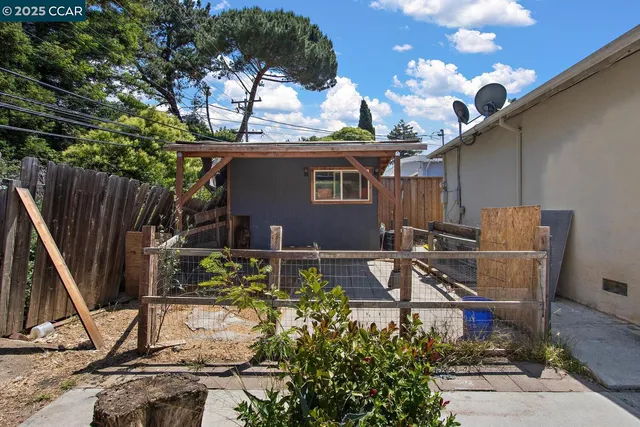 a view of backyard with a patio